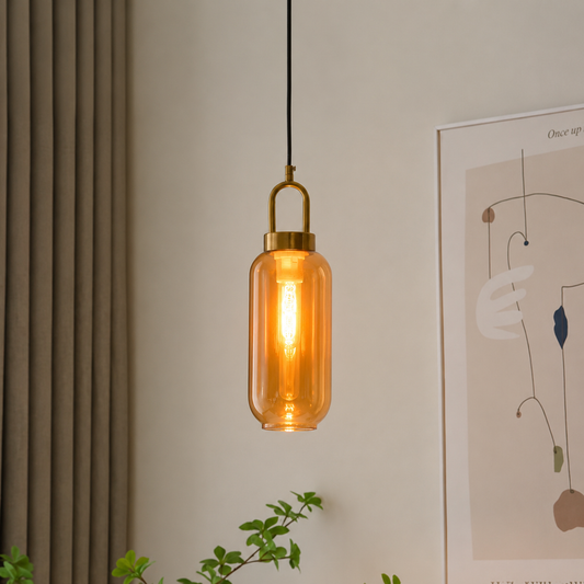 Lifestyle image of cylinder luminex hanging pendant light for elegant dining room decor styling and modern home lighting design.