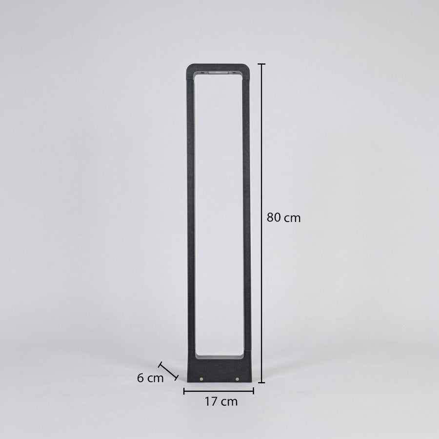 Slim modern outdoor bollard light with rectangular white diffuser and black frame on neutral background 80 cm height 17 cm width 6 cm depth suitable for pathway lighting.