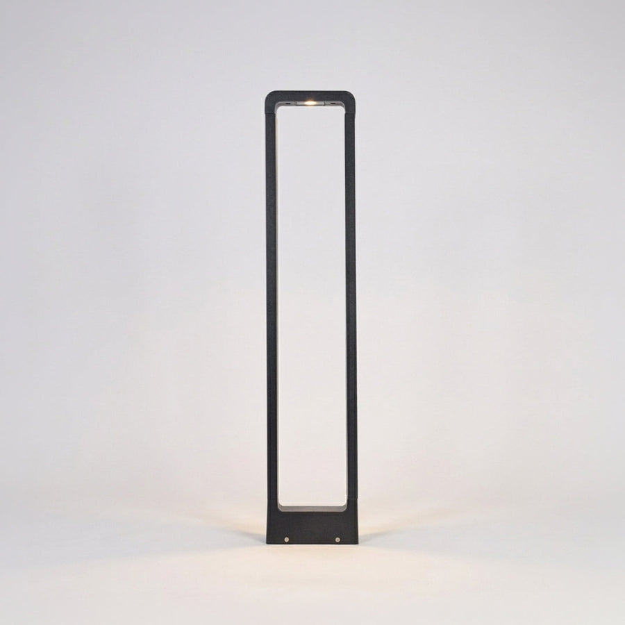 Minimal outdoor pathway light with rectangular metal frame and white diffuser on clean background perfect for contemporary exterior lighting.