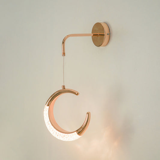 Premium rose gold crescent moon led wall sconce lighting fixture glowing on white background for modern home interior decor.