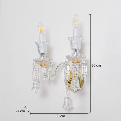 Double arm crystal wall light with gold base and crystal accents size 24cm height 30cm width 30cm depth displayed with measurements.