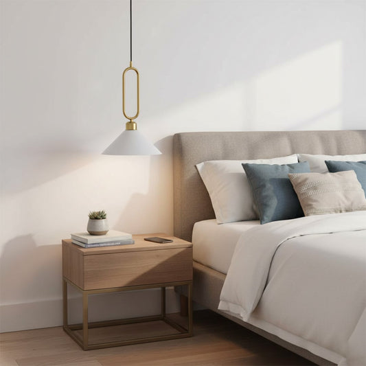 Black metal pendant light with gold loop accent enhancing bedroom decor with cozy ambiance.