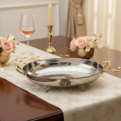 Silver metal serving tray lifestyle image with gold handles for elegant luxury dining table presentation decor.