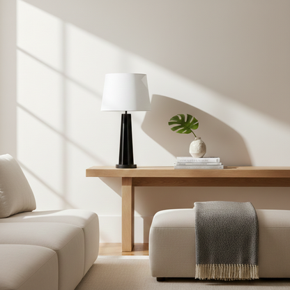 Black metal table lamp with white fabric shade for elegant modern living room lighting decor styling ideas.