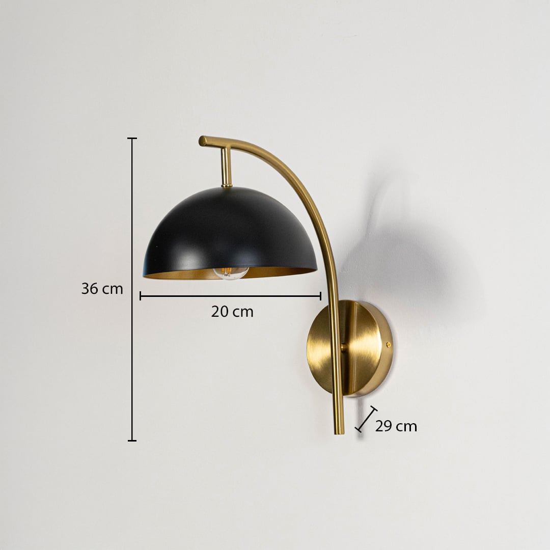 Modern black dome wall sconce with brass gold curved arm showing 36cm height 20cm shade width 29cm depth on white background.