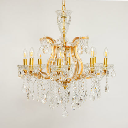 White background image of eight light gold transparent crystal chandelier for modern ceiling decor styling with elegant look.