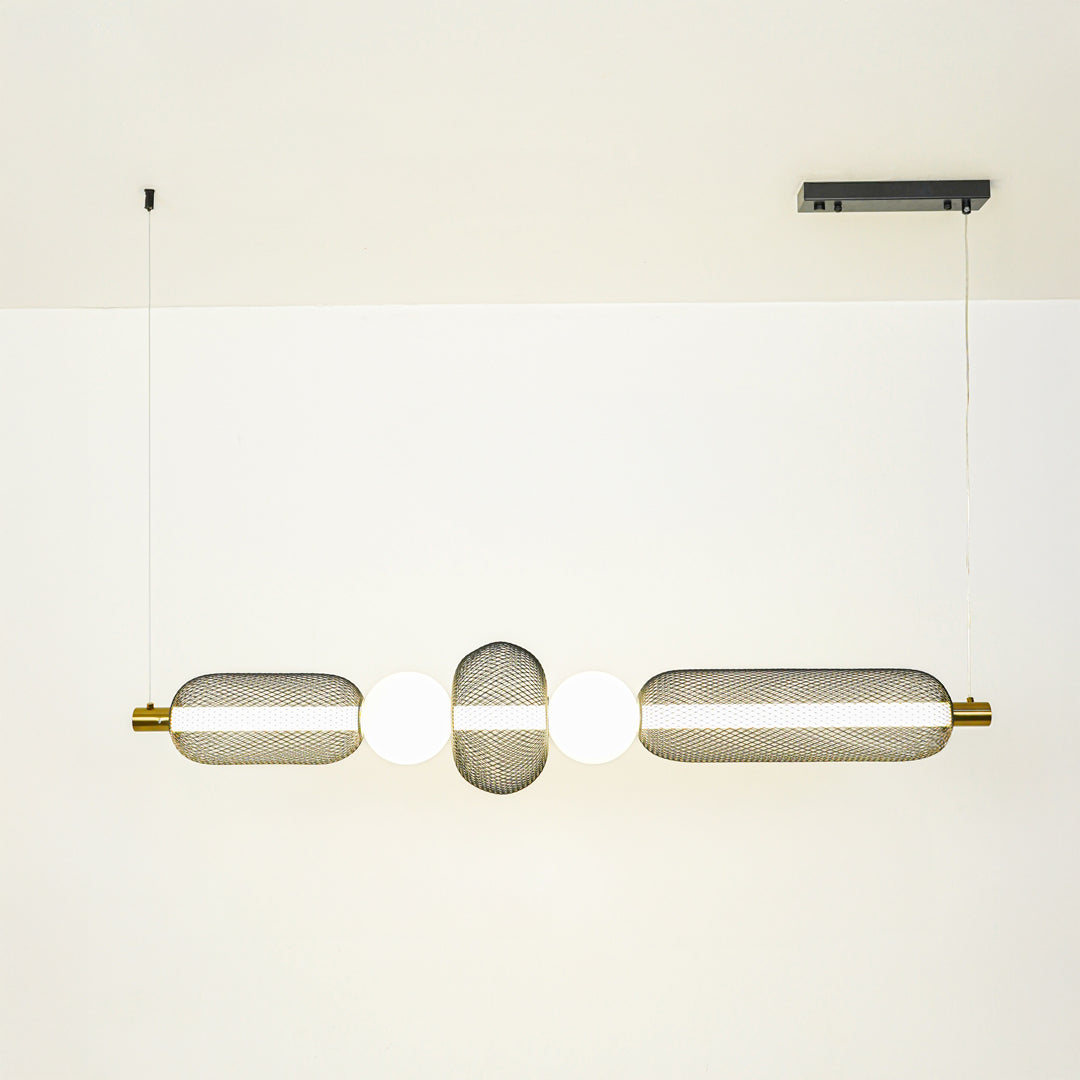 Minimal gold and white wall light with cylindrical glass shades mounted on neutral wall background ideal for modern bathroom or hallway lighting.

