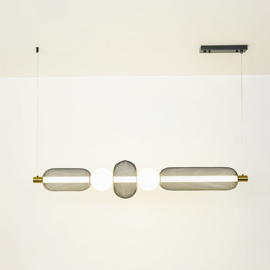 Minimal gold and white wall light with cylindrical glass shades mounted on neutral wall background ideal for modern bathroom or hallway lighting.

