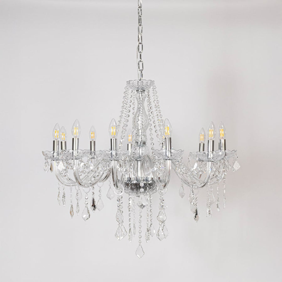 Classic chandelier with silver finish and crystal accents displayed off on white background for luxury home decor.
