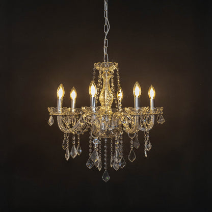 Elegant chandelier with silver frame and crystal droplets illuminated against black background for decor.