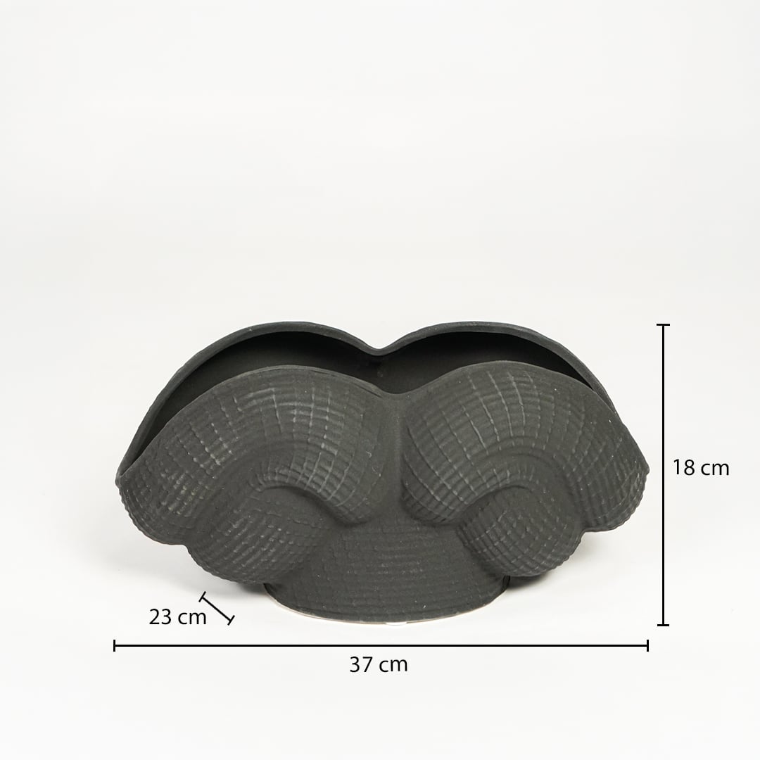 Black ceramic Maria Weave vase measuring 18 cm height 37 cm width and 23 cm depth ideal for tabletop decor placement.
