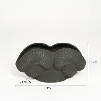 Black ceramic Maria Weave vase measuring 18 cm height 37 cm width and 23 cm depth ideal for tabletop decor placement.