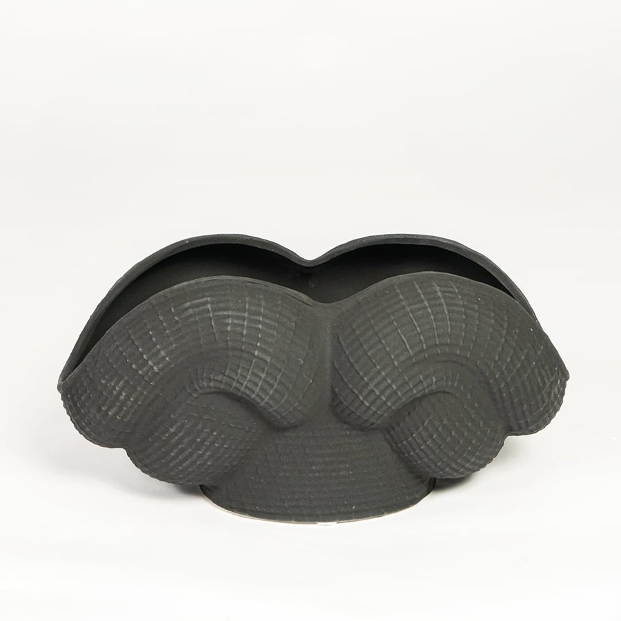 Black ceramic Maria Weave vase with sculpted textured design isolated on clean white background for modern home decor styling.