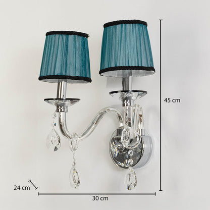 Double arm wall light with chrome base blue fabric shades and crystal drops size 24cm height 45cm width 30cm depth displayed with measurements.