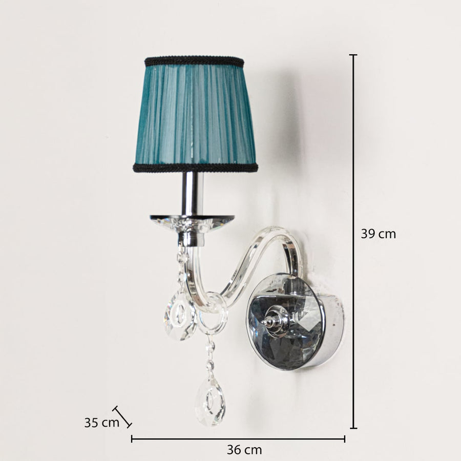 Elegant wall light with a blue fabric shade curved chrome arm and hanging crystal accents shown with dimensions of 39 cm height and 36 cm width.