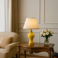 Modern gold LED picture light illuminating framed wall art in a cozy living room setting to enhance home decor ambiance and style.