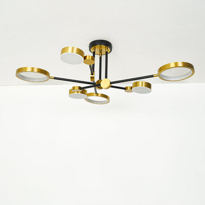 Minimal gold and black ceiling light with sleek multi arm design mounted on white ceiling background perfect for contemporary interior lighting.
