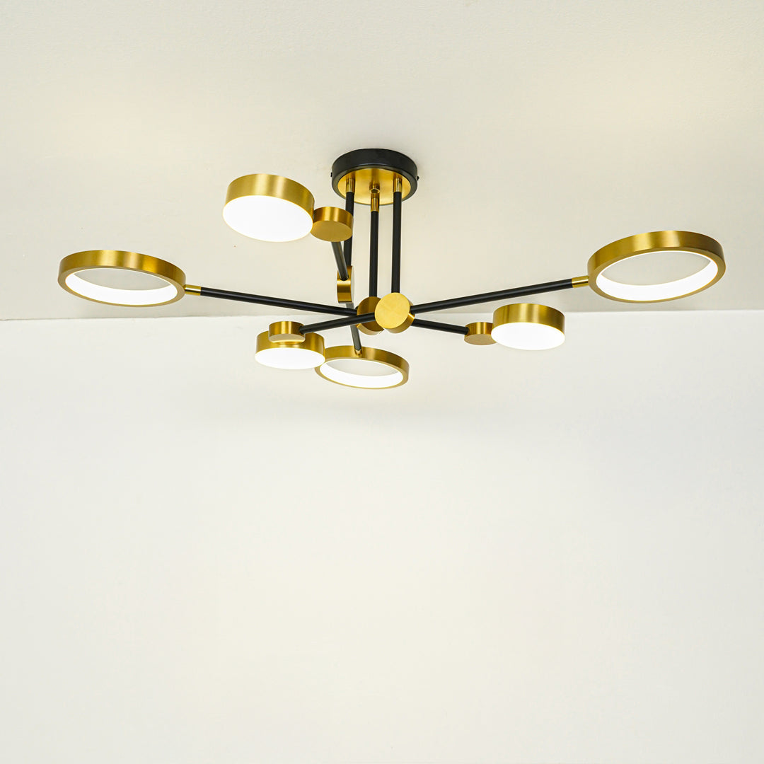 Contemporary gold ceiling light with multiple glass globe shades mounted on white ceiling background ideal for modern home lighting setup.