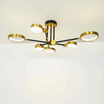 Contemporary gold ceiling light with multiple glass globe shades mounted on white ceiling background ideal for modern home lighting setup.
