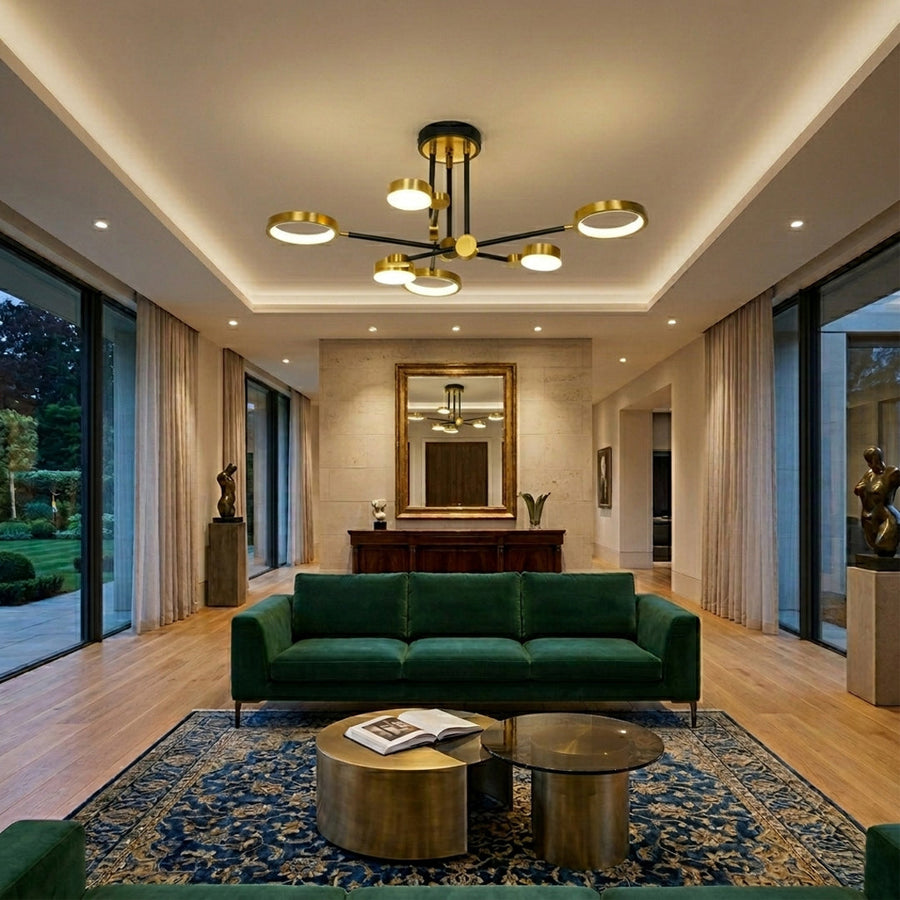 Elegant multi arm chandelier with gold metal finish installed in luxury living room with ceiling design and plush interior decor background.