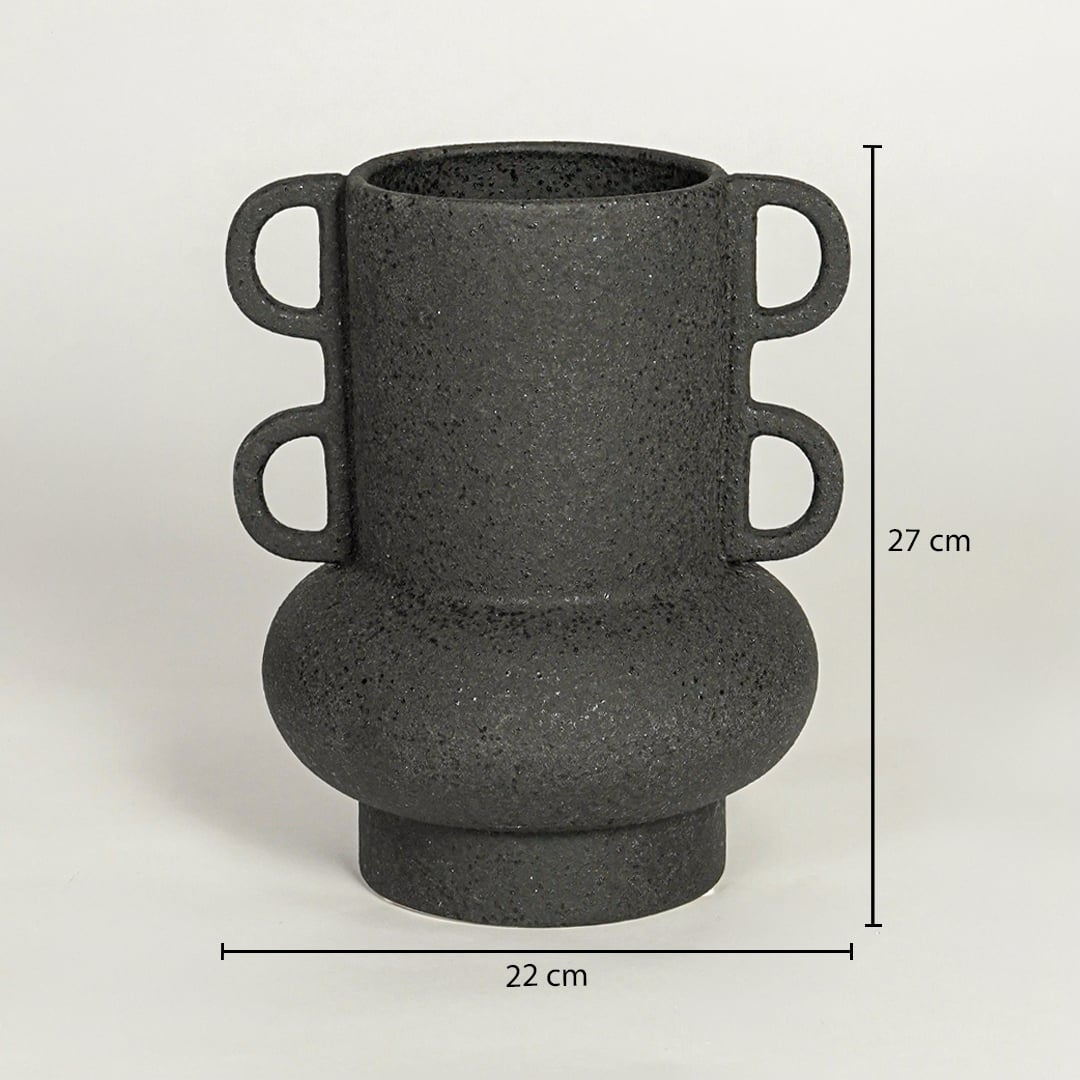 Black ceramic decorative vase with sculptural handles showing 27 cm height and 22 cm width suitable for table shelf or console placement.