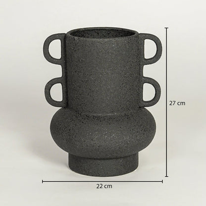 Black ceramic decorative vase with sculptural handles showing 27 cm height and 22 cm width suitable for table shelf or console placement.