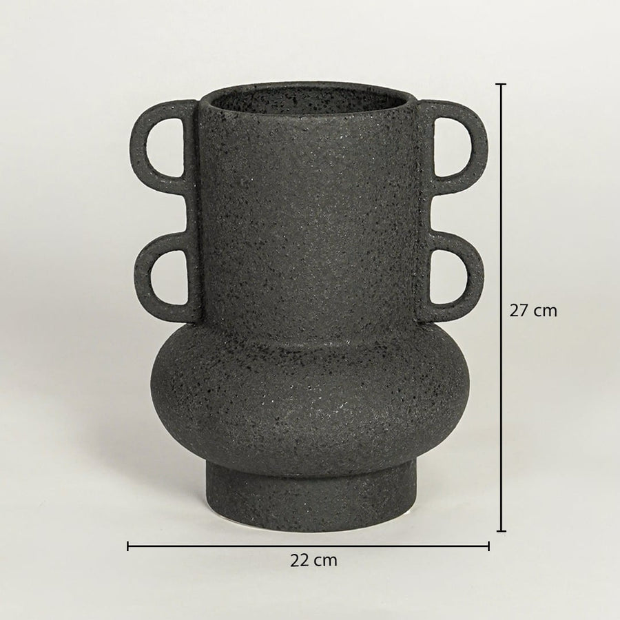 Black ceramic decorative vase with sculptural handles showing 27 cm height and 22 cm width suitable for table shelf or console placement.