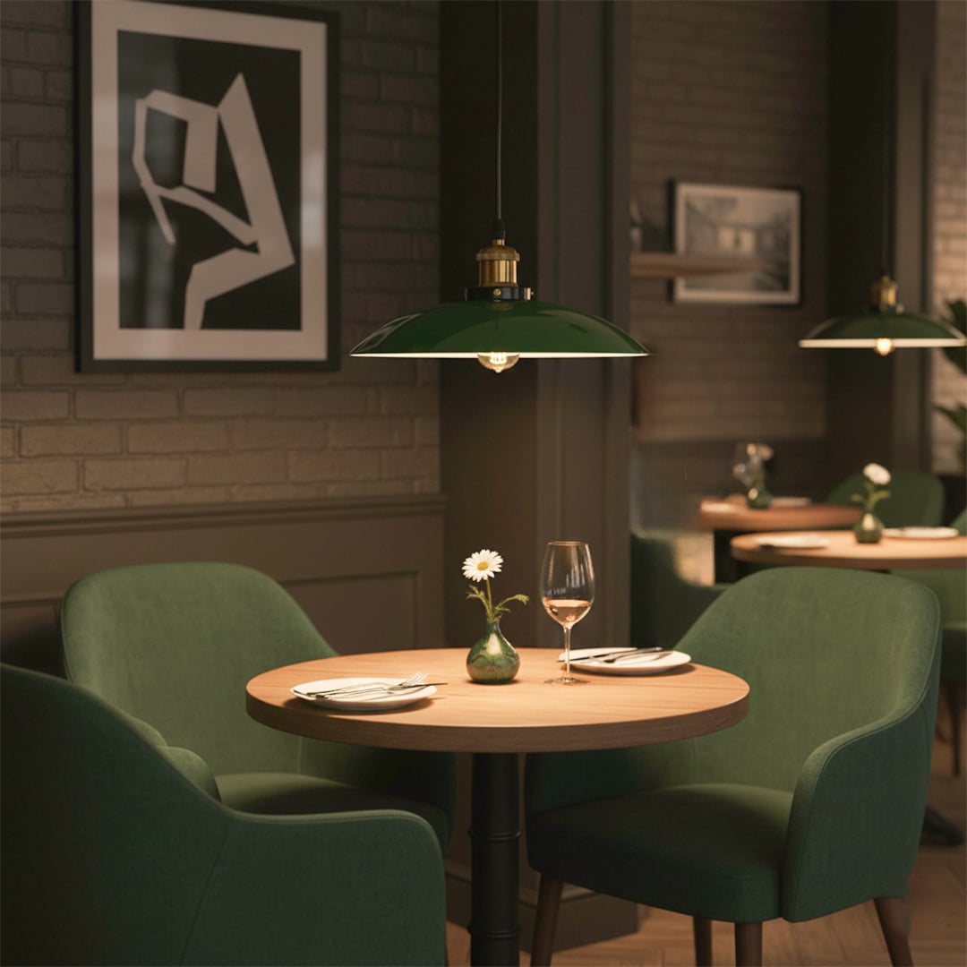 Green metal pendant light with brass accents enhancing contemporary dining room decor with inviting warmth.