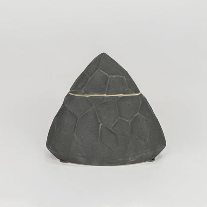 Modern black decorative ceramic showpiece isolated clean background stylish home decor accent piece.