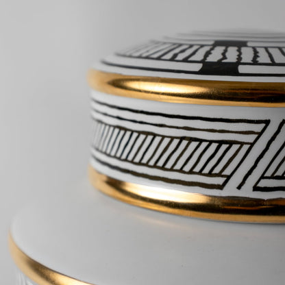 Black and gold patterned ceramic jar in a close-up view perfect for luxury décor styling and premium interior accents.