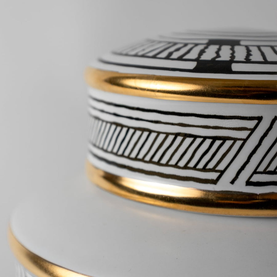 Black and gold patterned ceramic jar in a close-up view perfect for luxury décor styling and premium interior accents.