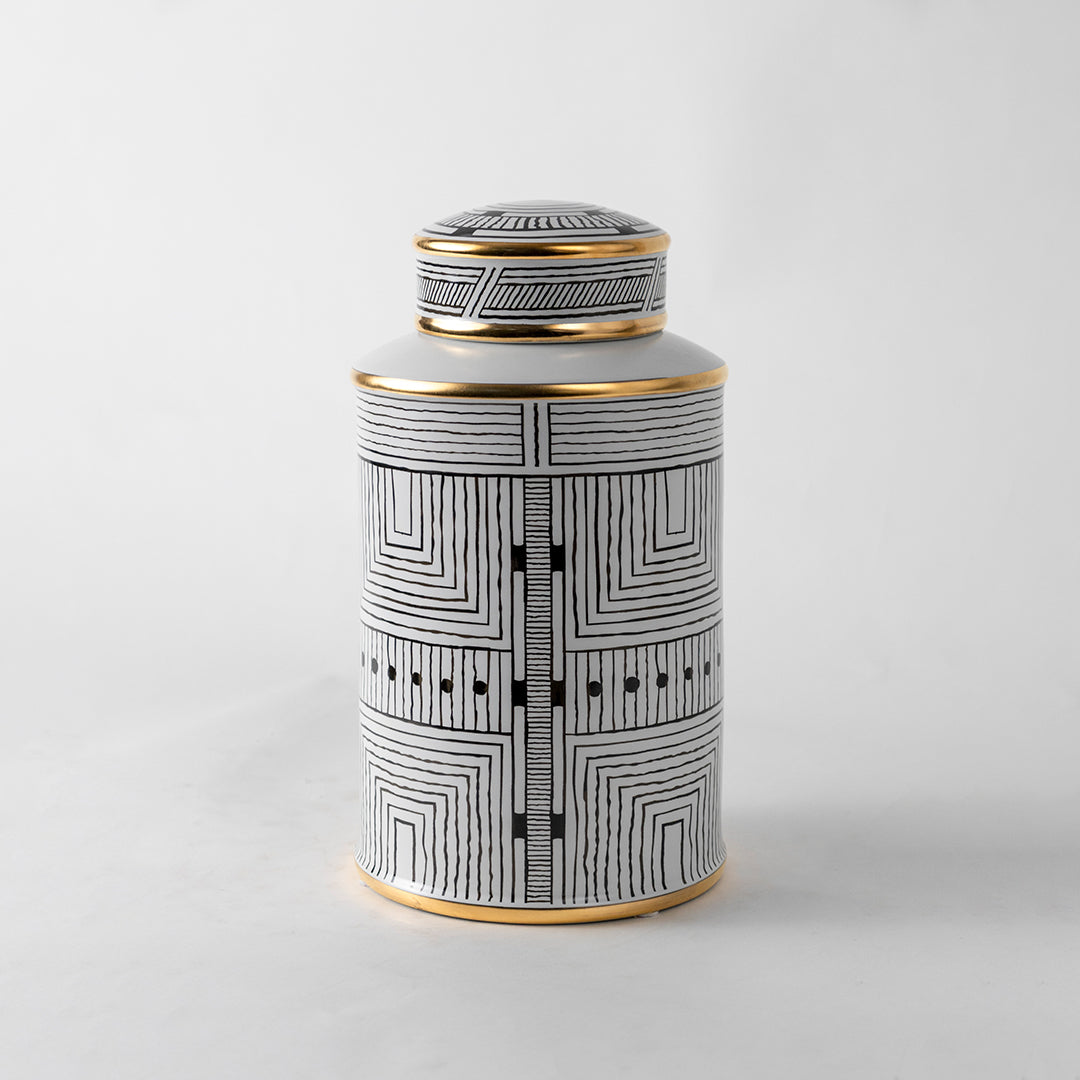 White ceramic decorative jar with geometric black pattern and gold lid for modern shelf styling and home decor.
