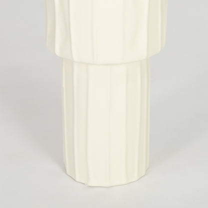 Closeup image of white ceramic fluted vase for elegant console table decor styling with smooth matte finish.