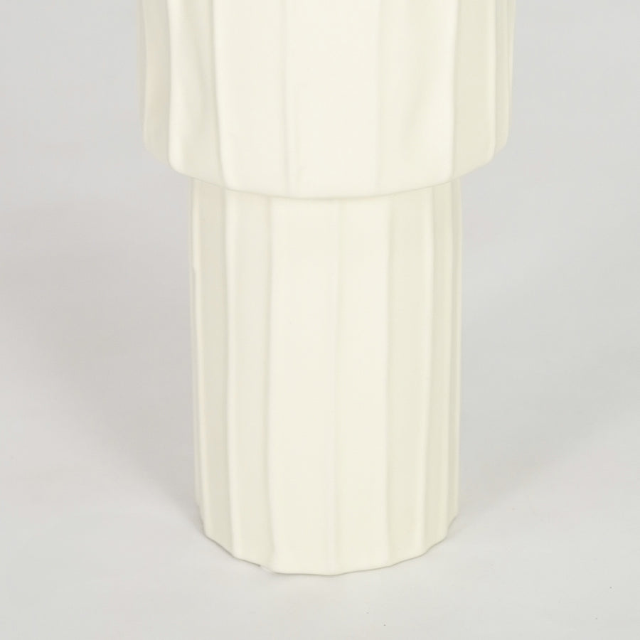 Closeup image of white ceramic fluted vase for elegant console table decor styling with smooth matte finish.