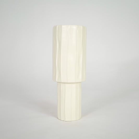 Cream ribbed ceramic vase for elegant console table placement and contemporary indoor decor styling accent.