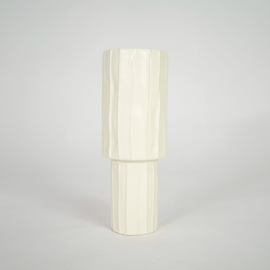 Cream ribbed ceramic vase for elegant console table placement and contemporary indoor decor styling accent.