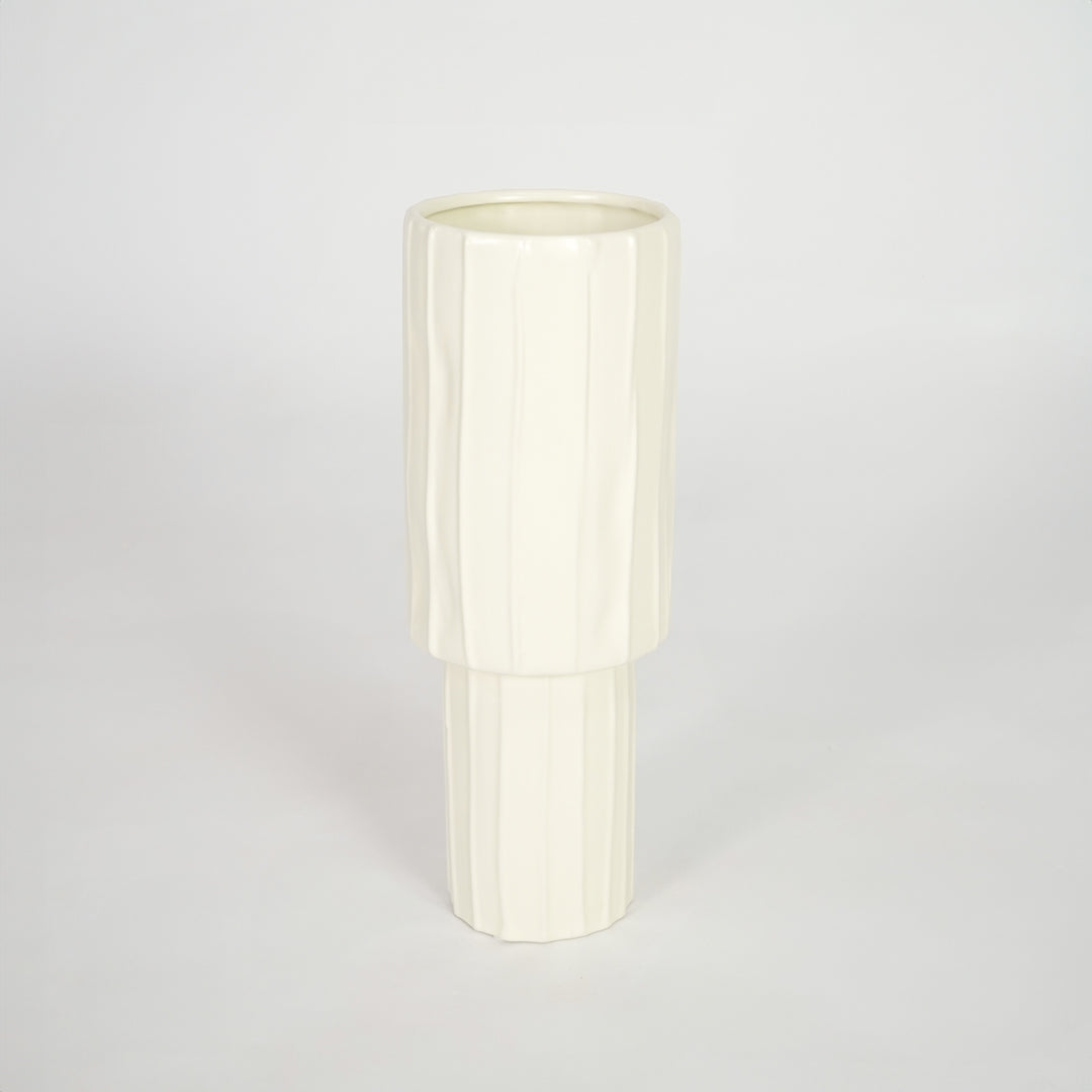 Minimalist cream ceramic vase for stylish coffee table placement and modern living room decor styling piece.