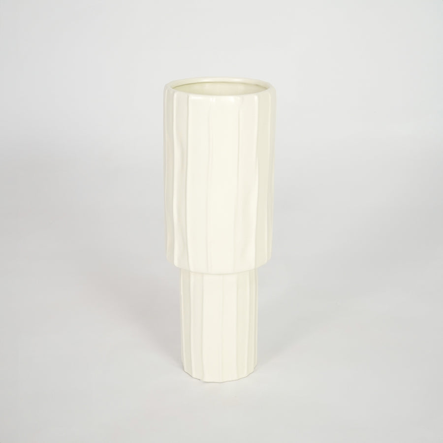 Minimalist cream ceramic vase for stylish coffee table placement and modern living room decor styling piece.
