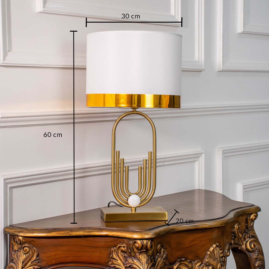 White shade gold metal table lamp with visible size 60cm height and 30cm width placed on carved wooden console table with light off for modern luxury décor.