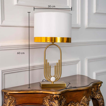 White shade gold metal table lamp with visible size 60cm height and 30cm width placed on carved wooden console table with light off for modern luxury décor.