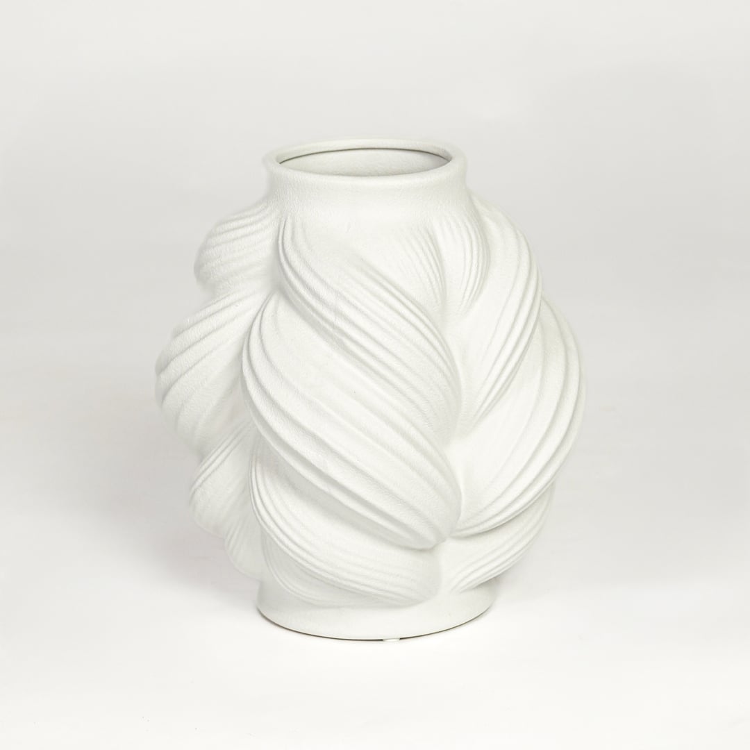 White ceramic sculpted leaf design vase with layered curved pattern isolated on clean white background for modern decor styling.