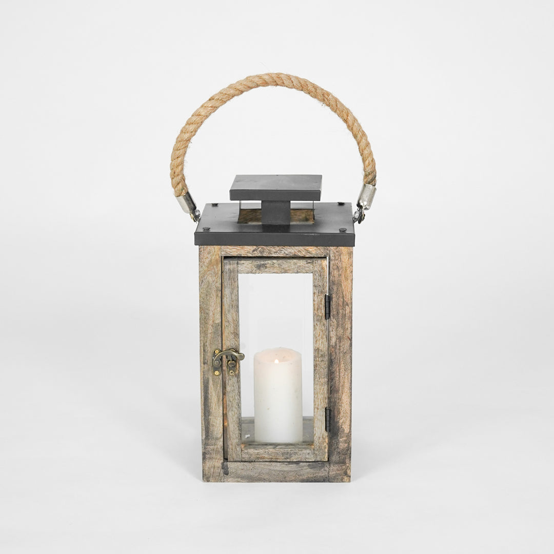 Wooden lantern with a candle inside on a white background