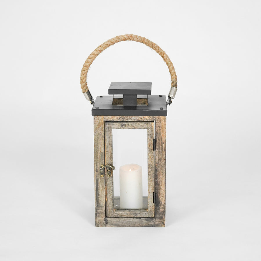 Wooden lantern with a candle inside on a white background