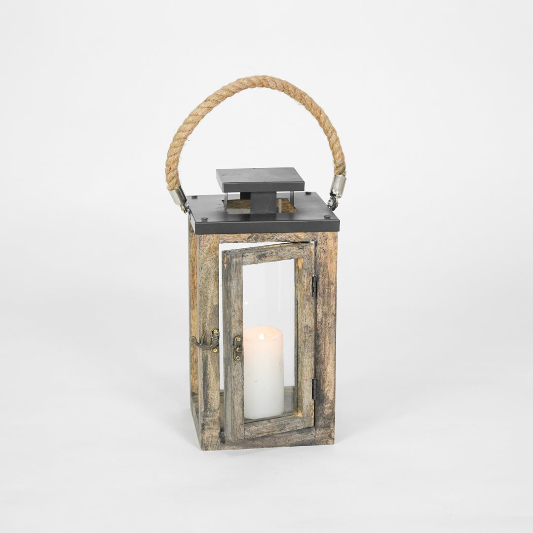 Wooden lantern with a candle inside on a white background