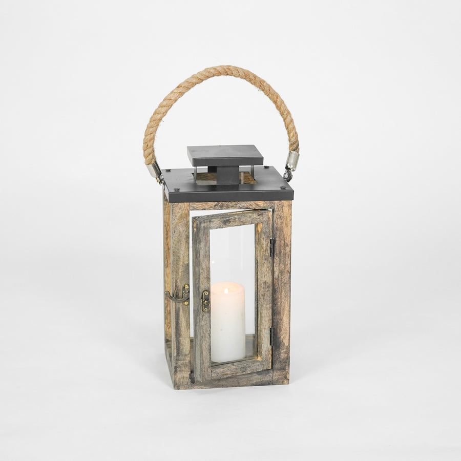 Wooden lantern with a candle inside on a white background
