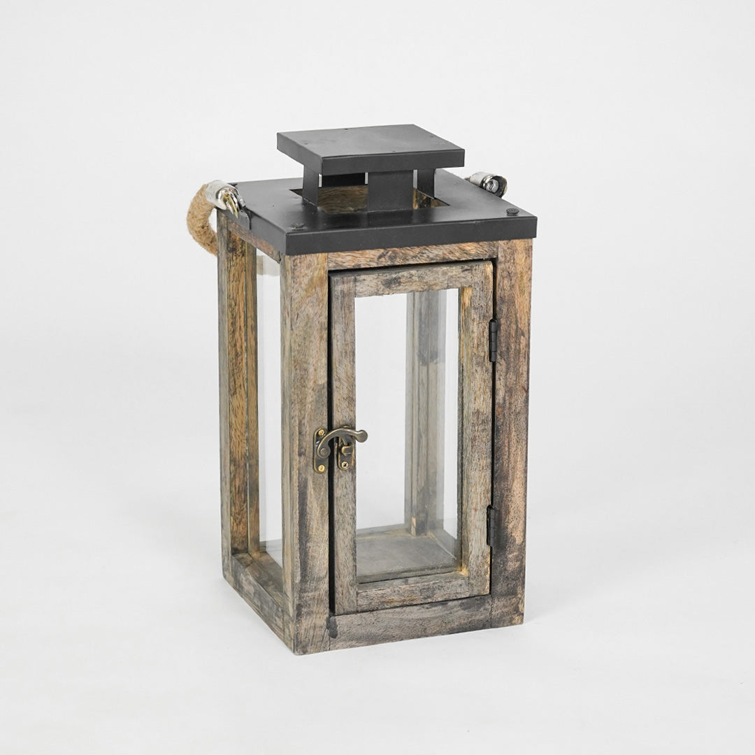 Wooden lantern with a black top on a white background