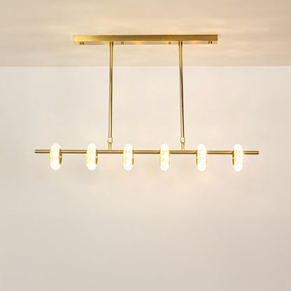 Gold metal linear chandelier with illuminated tube shades creating elegant ambient lighting for modern dining spaces.