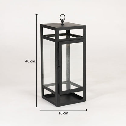 Black metal lantern with clear glass panels measuring 40 cm height and 16 cm width suitable for floor tabletop and outdoor Decor.