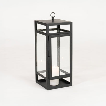 Minimal black metal candle lantern with transparent glass panels on white background perfect for home festive and patio Decor.