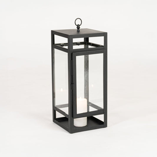 Minimal black metal candle lantern with transparent glass panels on white background perfect for home festive and patio Decor.